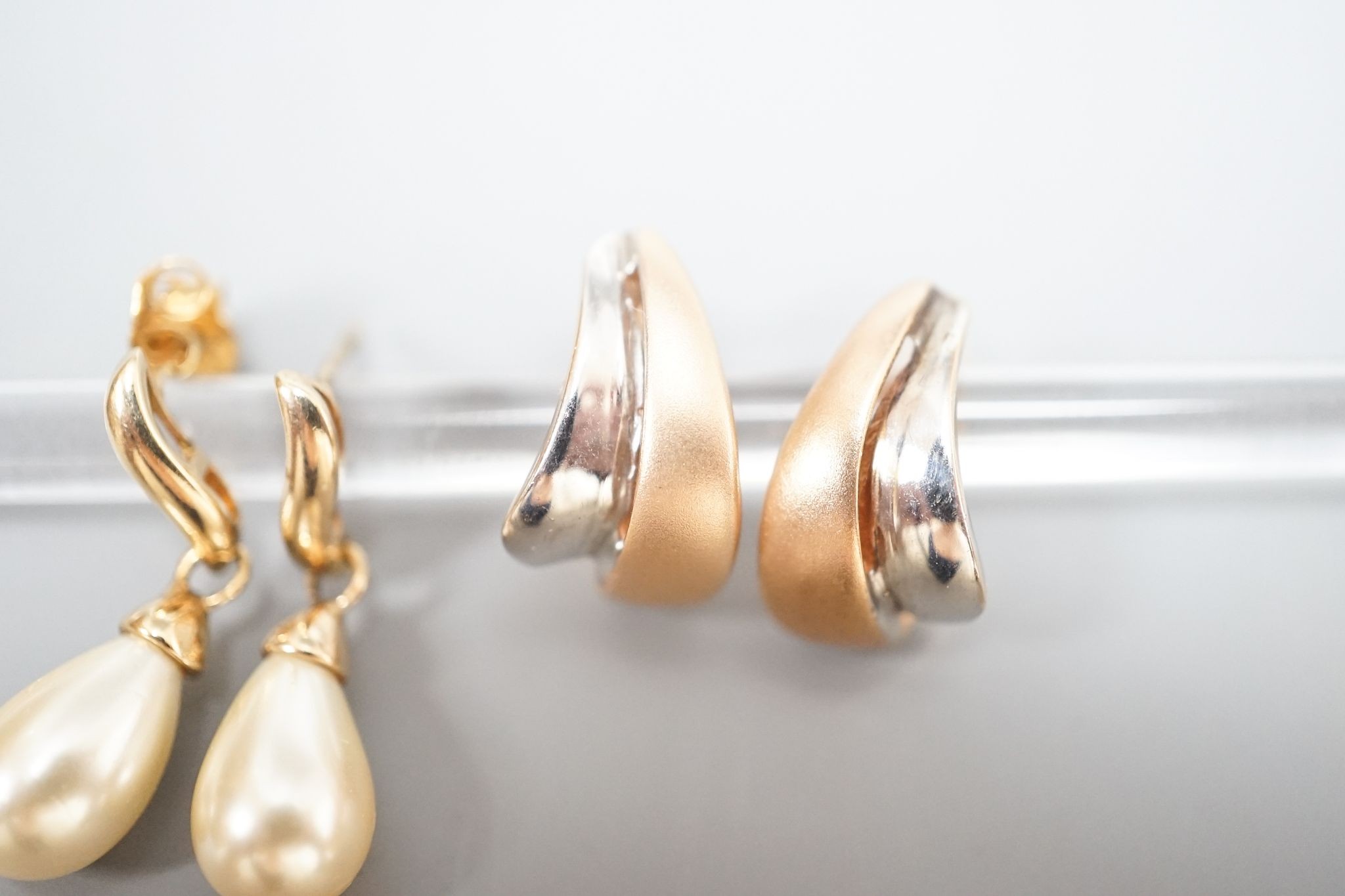 A modern pair of two colour 14k earrings, 4.1 grams and a pair of simulated pearl set earrings.